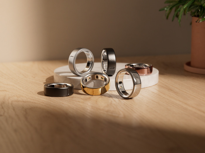Oura Ring 4, titanium smart ring on white background
