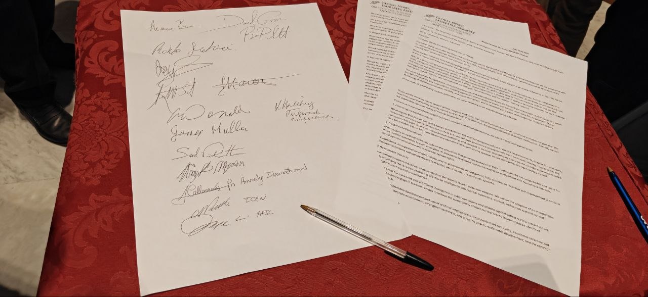 The signed Rome Declaration, photographed at the assembly at Borgo Laudato Si'.